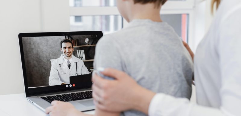 close-up-patient-talking-doctor-online